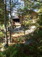 Log Cabin Exterior - Country homes for sale and luxury real estate including horse farms and property in the Caledon and King City areas near Toronto